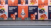 a row of posters on the side of a building