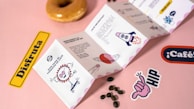 a donut sitting on top of a pink table