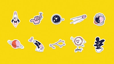 a bunch of stickers on a yellow background