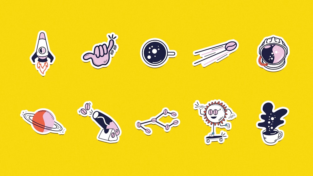 a bunch of stickers on a yellow background