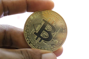 A user holding the solominer, illustrating its portability and ease of use for decentralized bitcoin mining.
