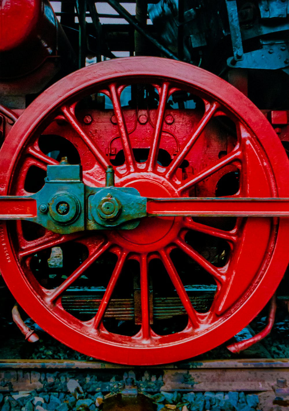 a close up of a red train wheel