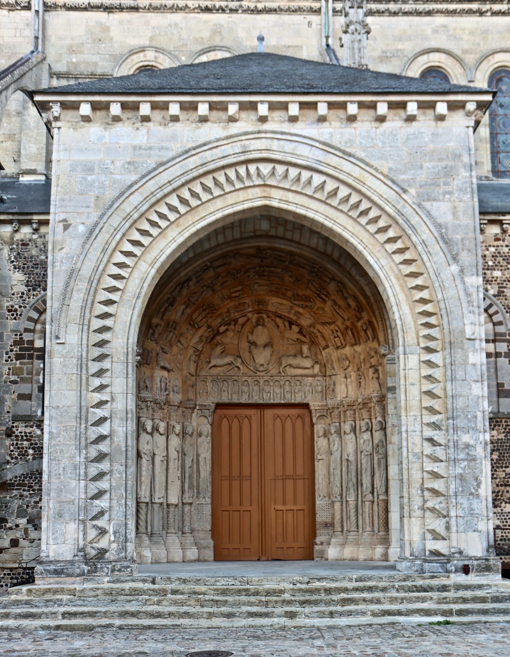 a large stone building with a wooden door