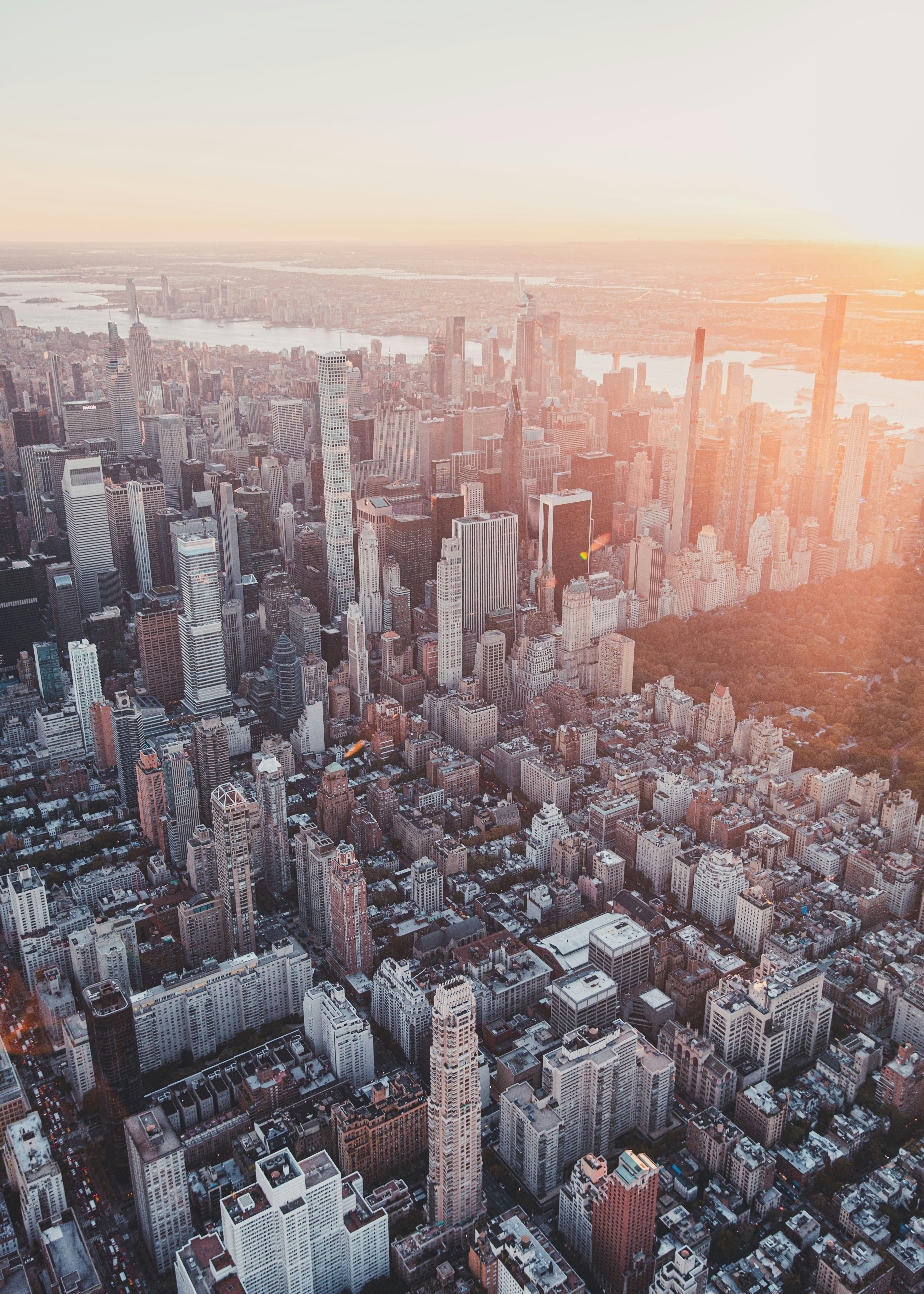 an aerial view of a city at sunset