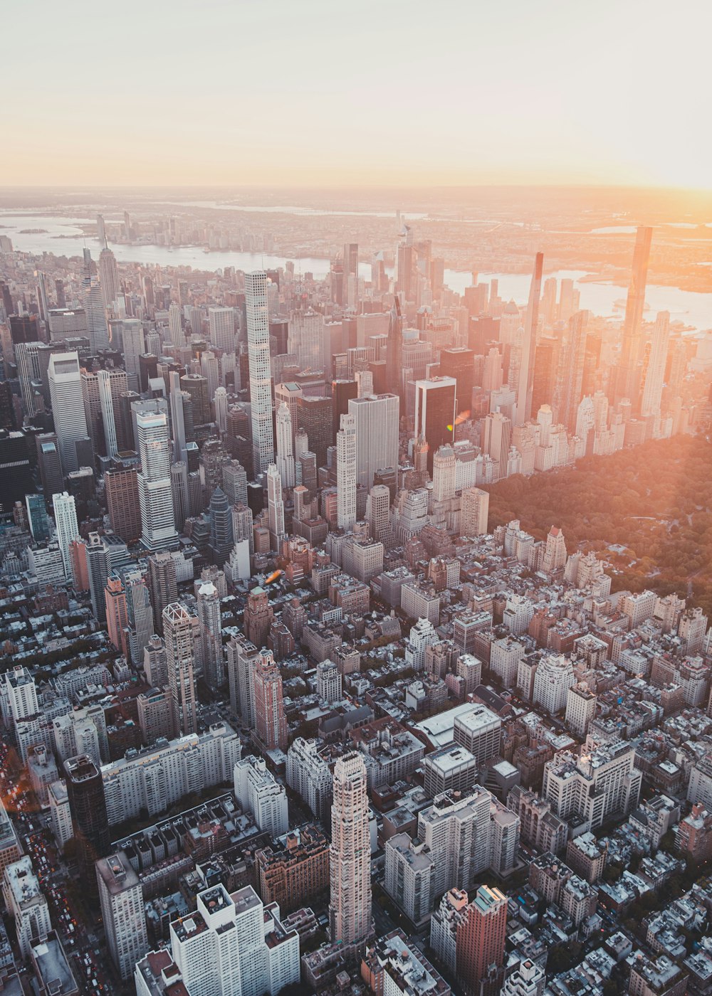 an aerial view of a city at sunset