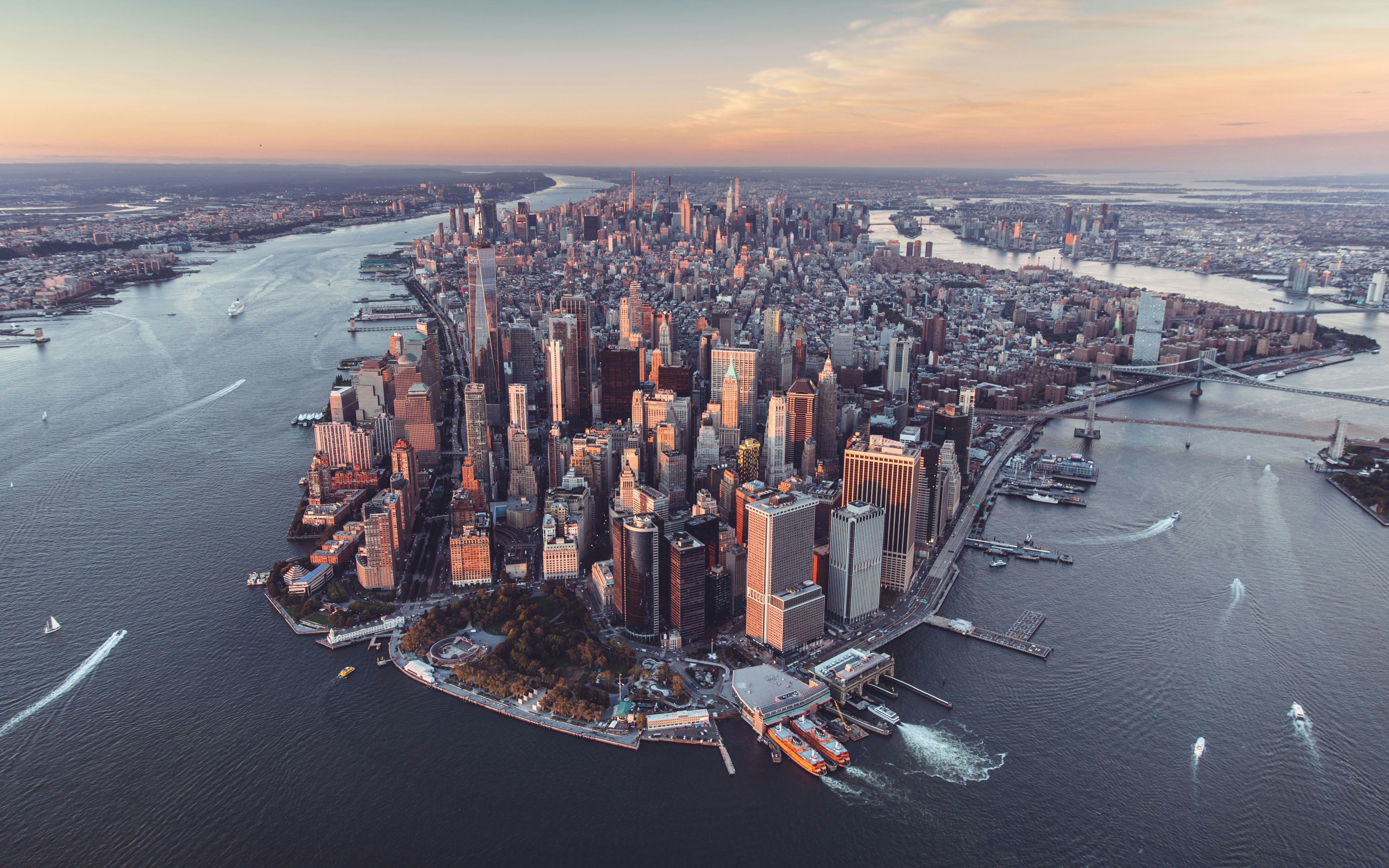 an aerial view of a large city in the middle of the ocean