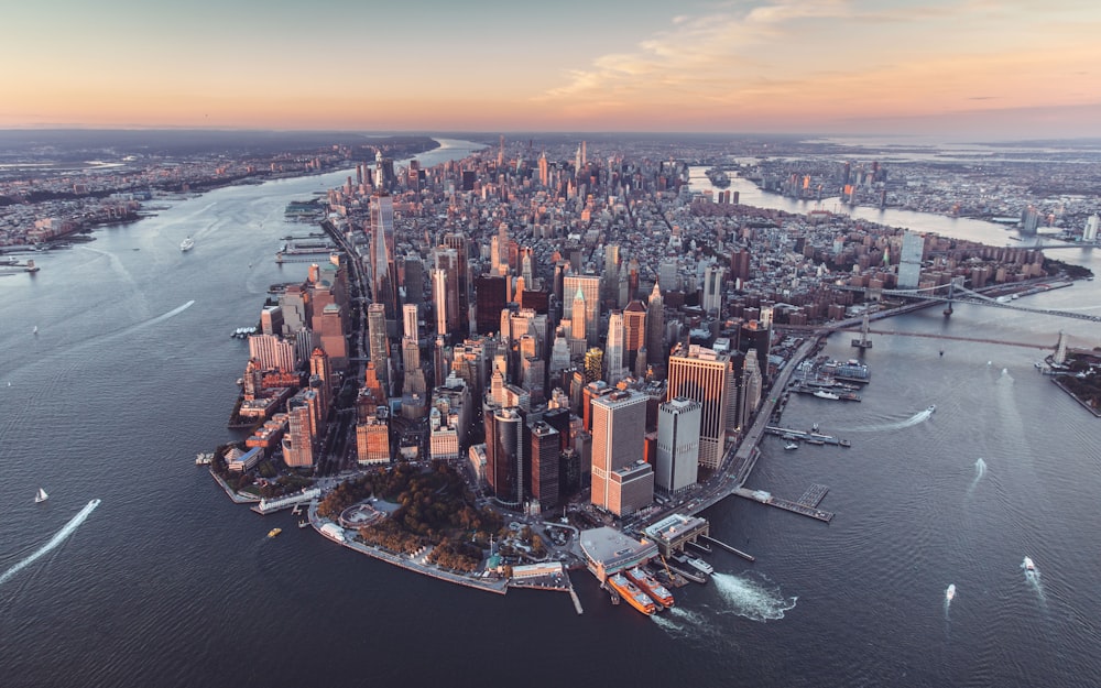 an aerial view of a large city in the middle of the ocean