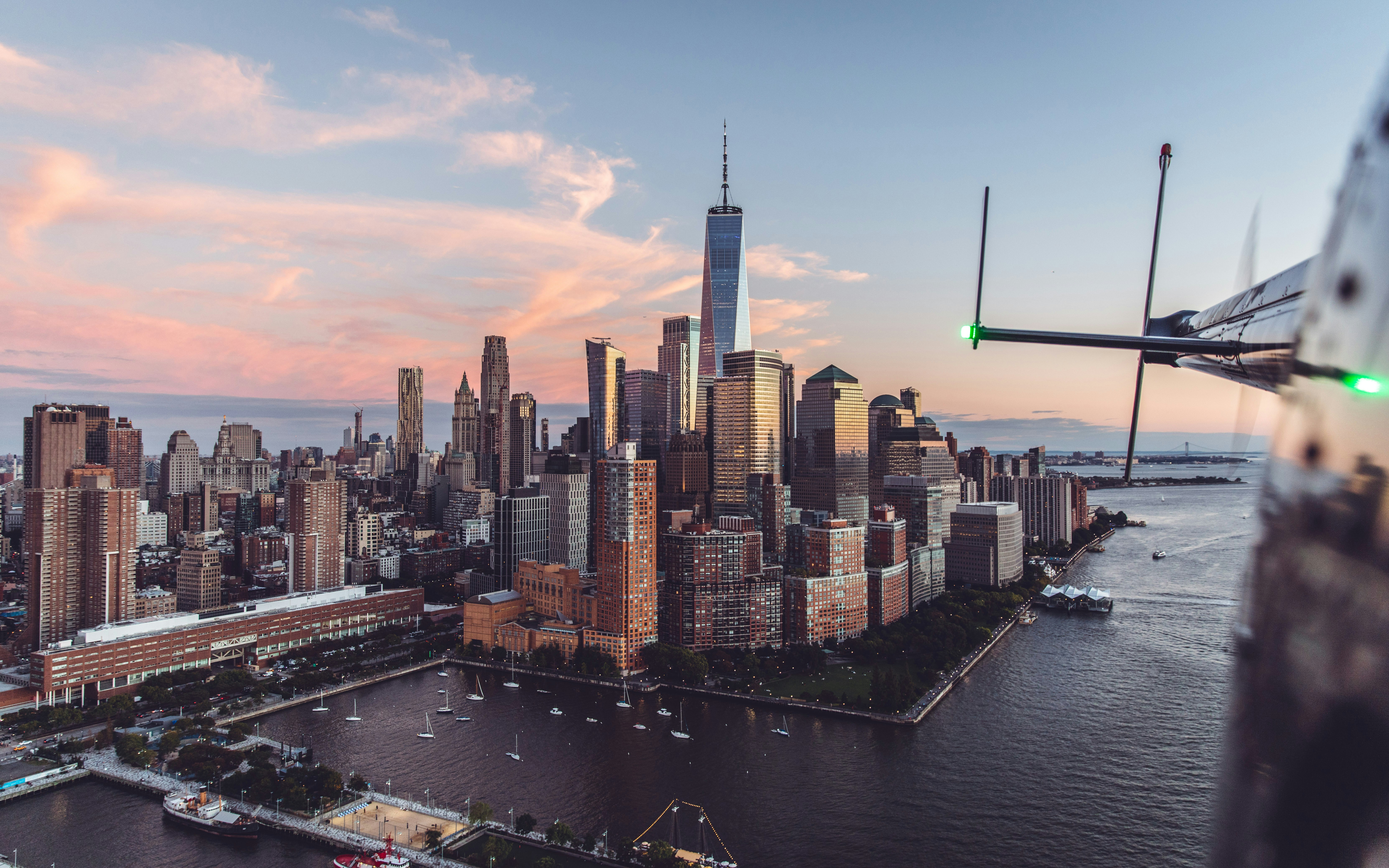 an aerial view of a city at sunset