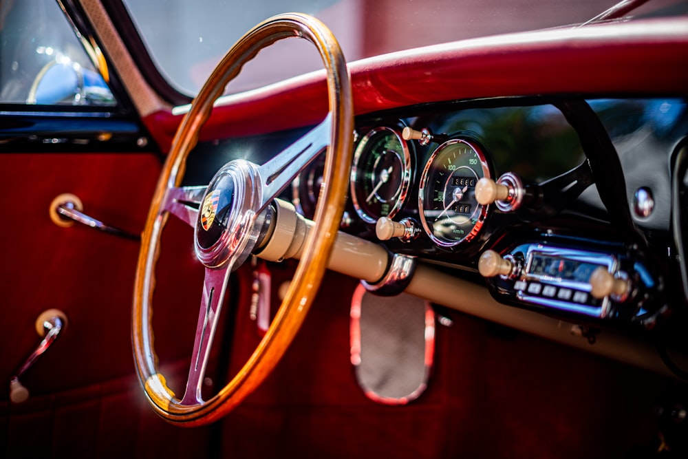 a close up of a steering wheel and dashboard of a car