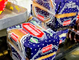 A creative food packaging design showcasing a local bakery's branding.