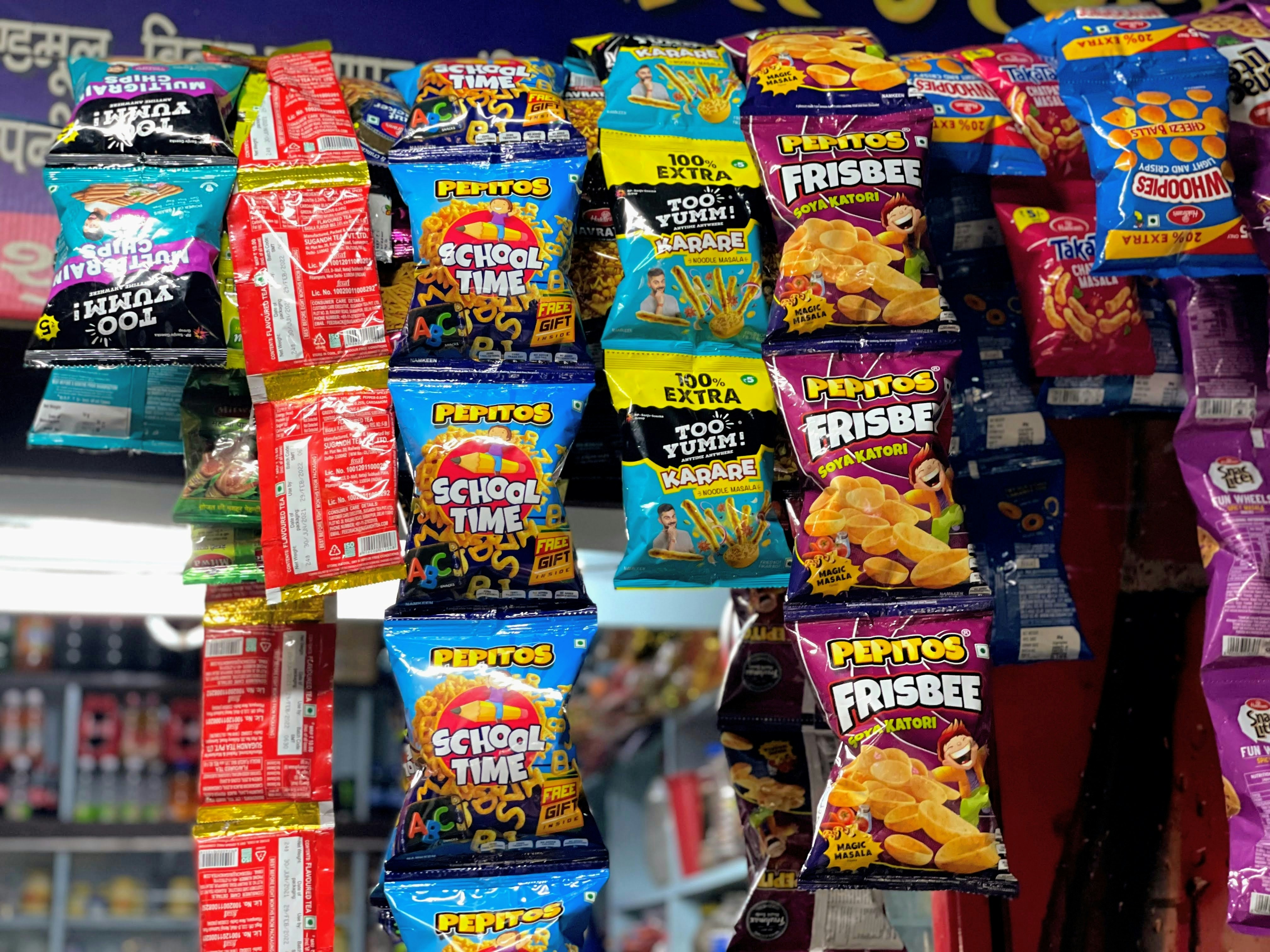 a display in a store filled with lots of snacks, 