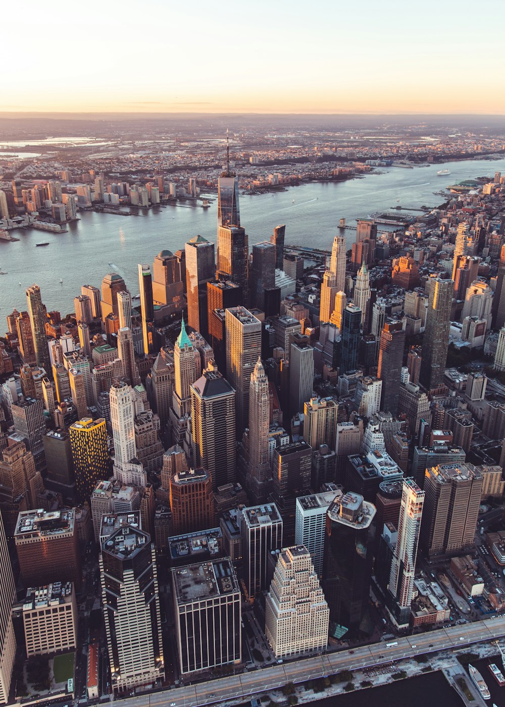 an aerial view of a city with tall buildings