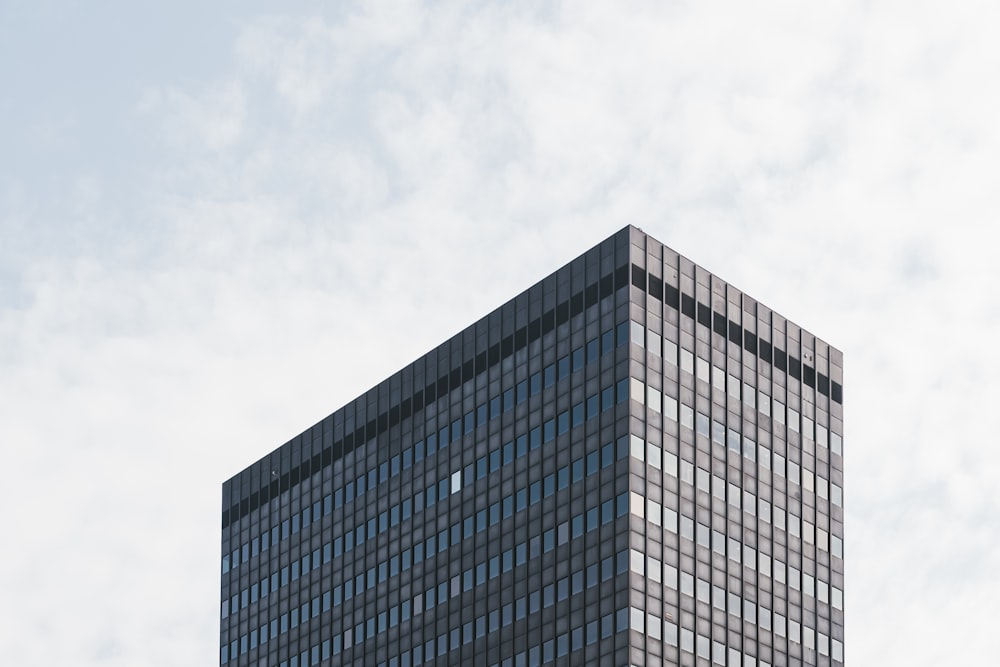 a very tall building with a sky background