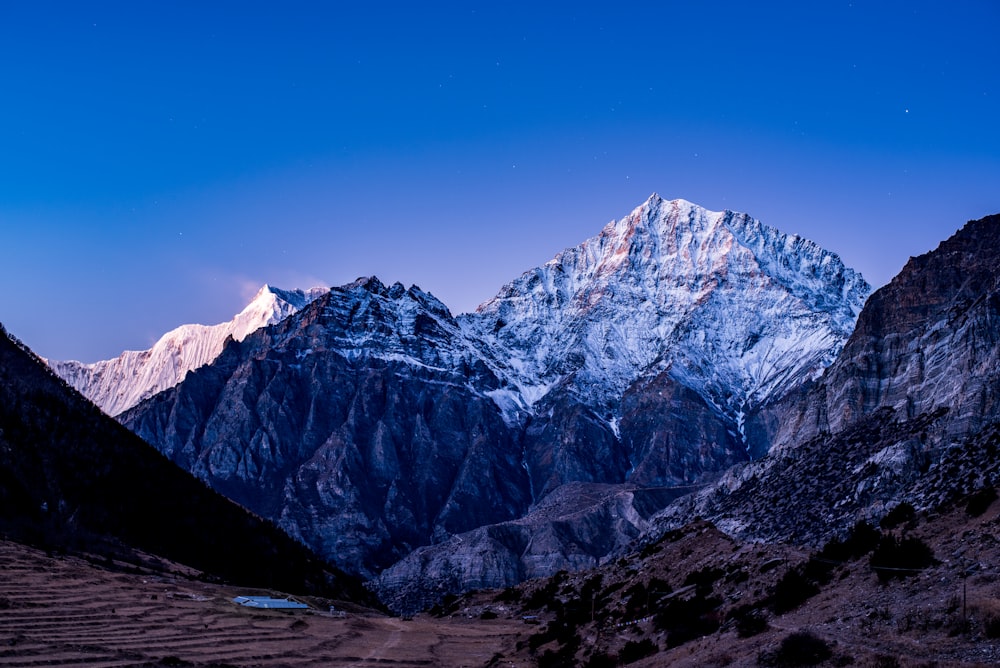 a mountain range with snow on the top of it