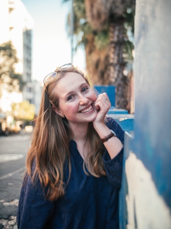 Casual portrait of Eklavya smiling warmly against a city backdrop.