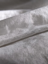 Close-up of the luxurious fabric texture of auri sleepwear.