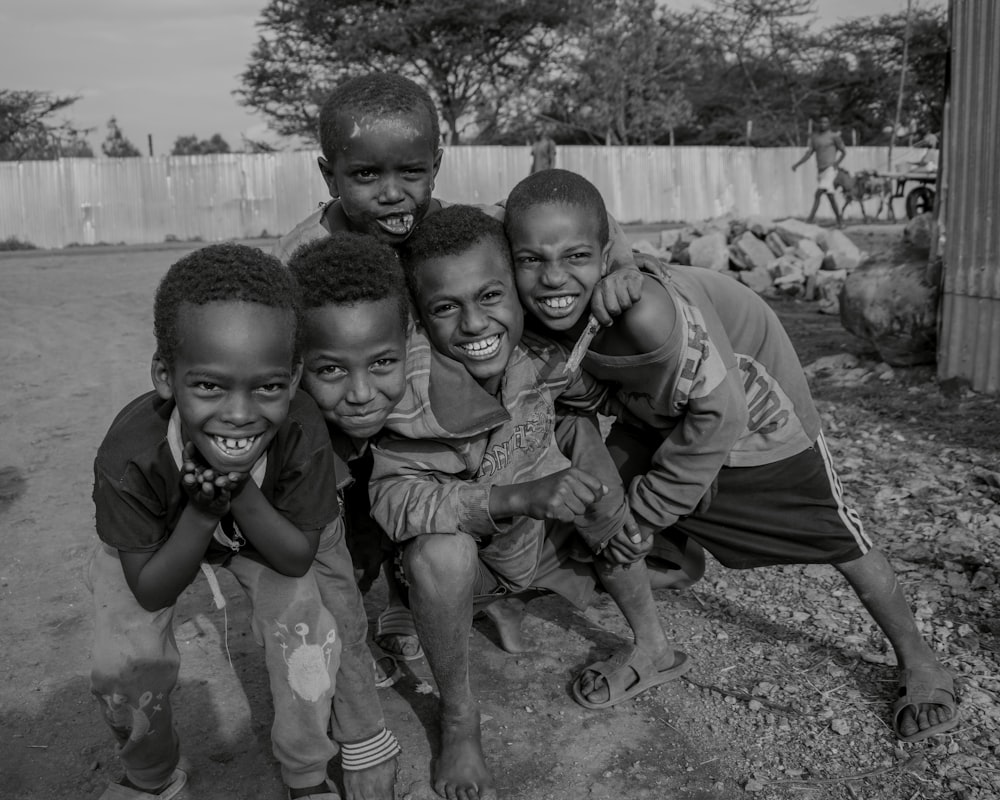 a group of young boys standing next to each other