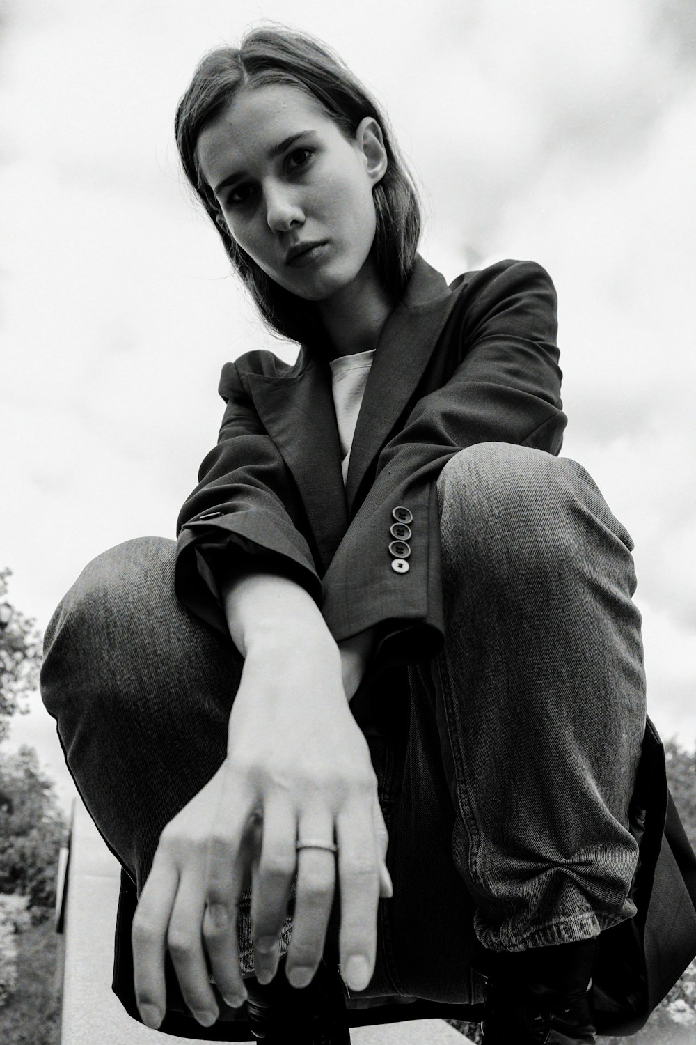 a woman sitting on top of a skateboard