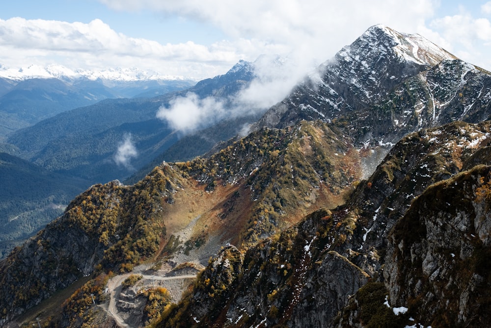 a view of the top of a mountain with a road in the foreground