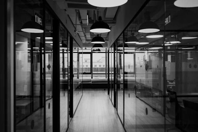 Low Lit Glazed Corridor — commercial glass partition interior design