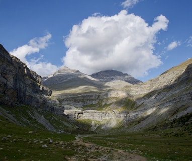 a view of a mountain range from a valley
