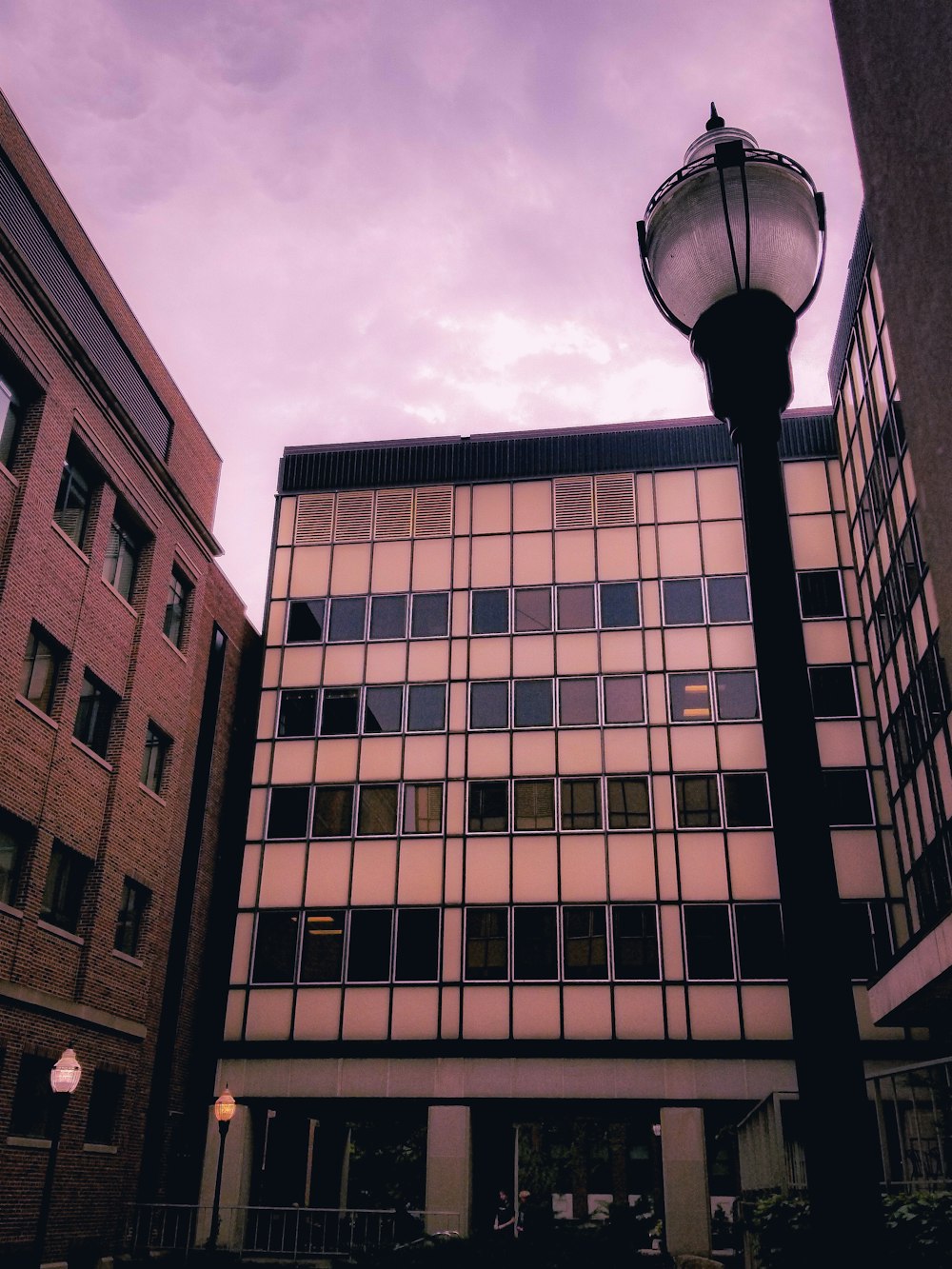 a street light in front of a tall building