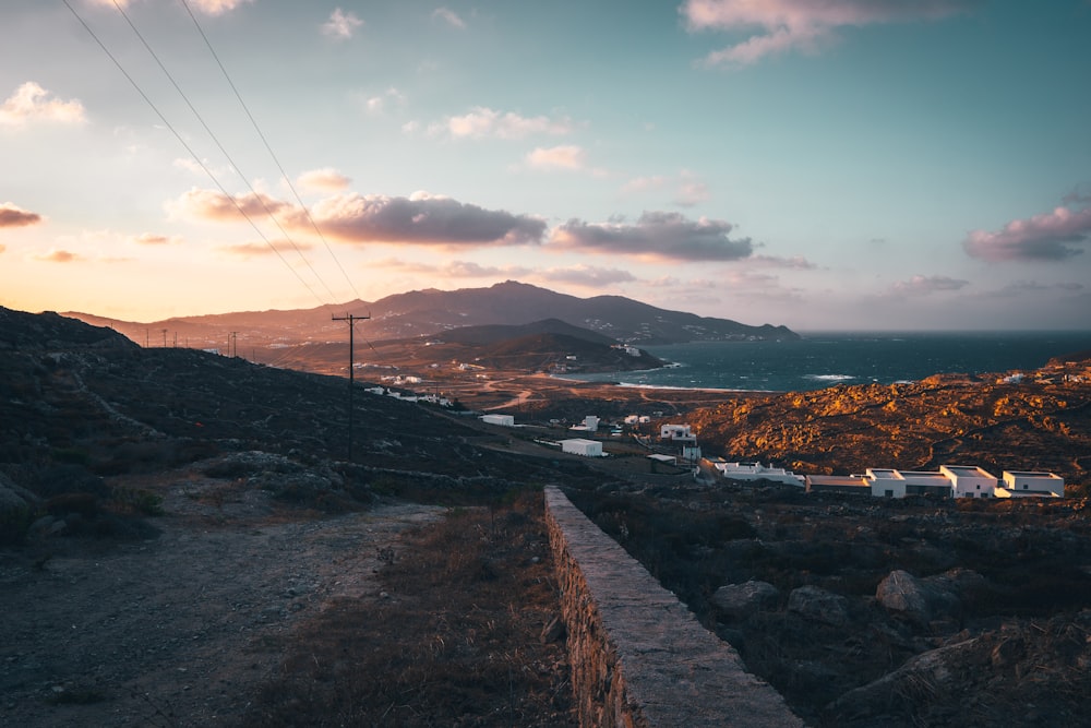 a scenic view of a small town on a hill