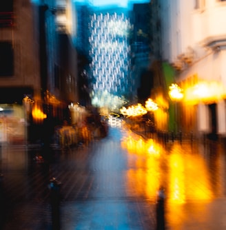 a blurry photo of a city street at night