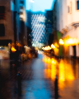 a blurry photo of a city street at night