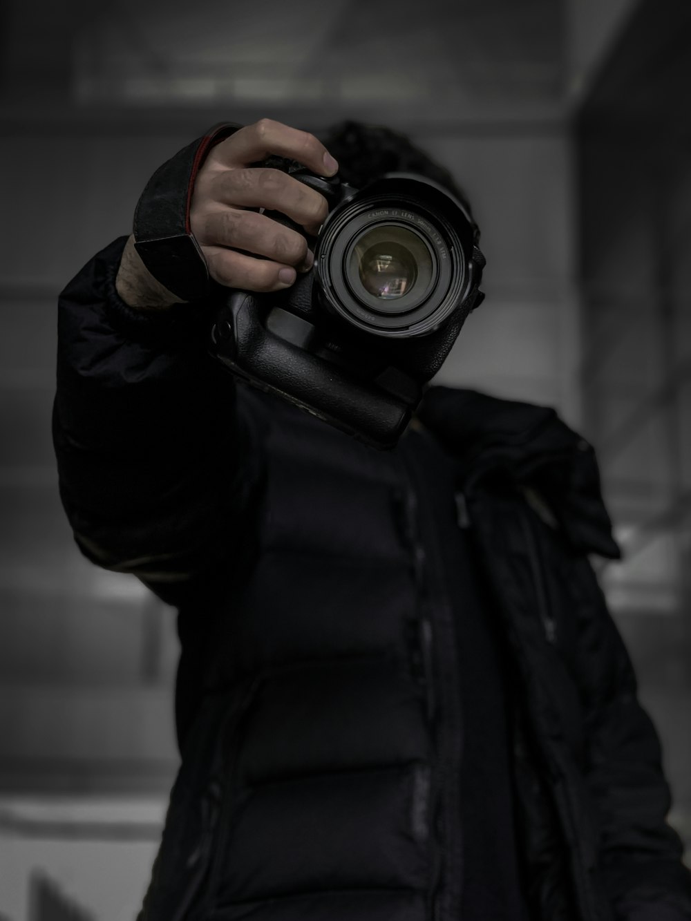 a man holding a camera up to his face