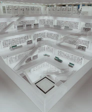 a room filled with lots of shelves filled with books