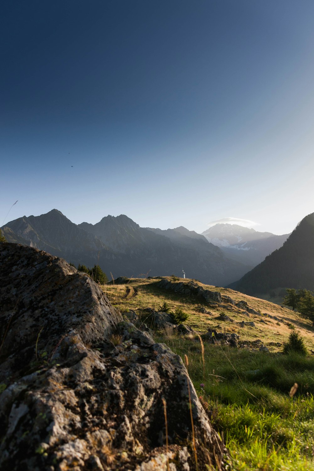 the sun shines brightly on a mountain range