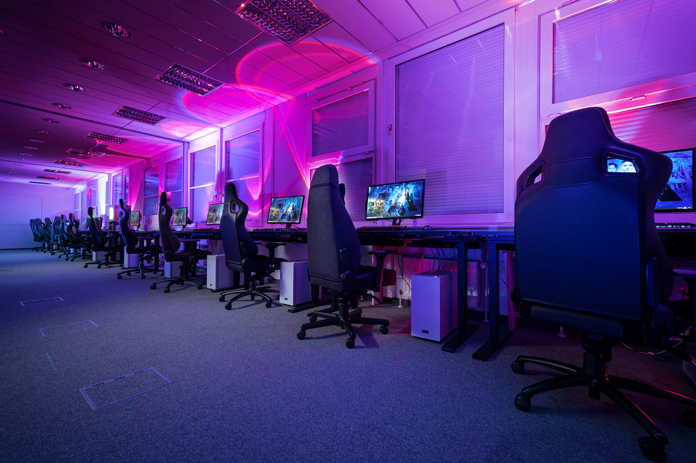 Close-up of a pro player's hands on a glowing keyboard mid-match