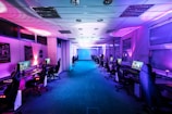 a room filled with lots of computer monitors