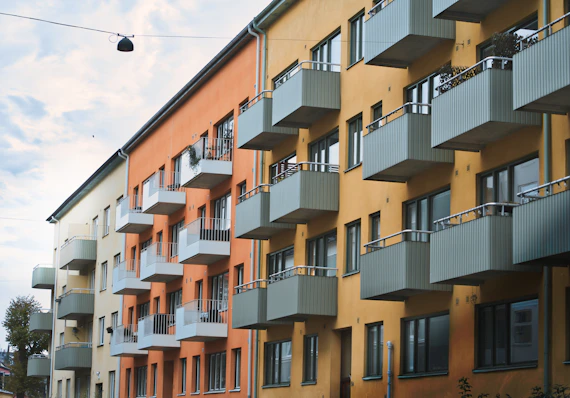 an apartment building with balconies and balconies on the balconies