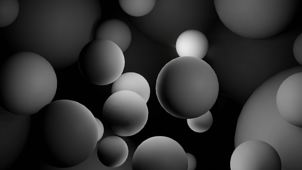 a black and white photo of a bunch of balls