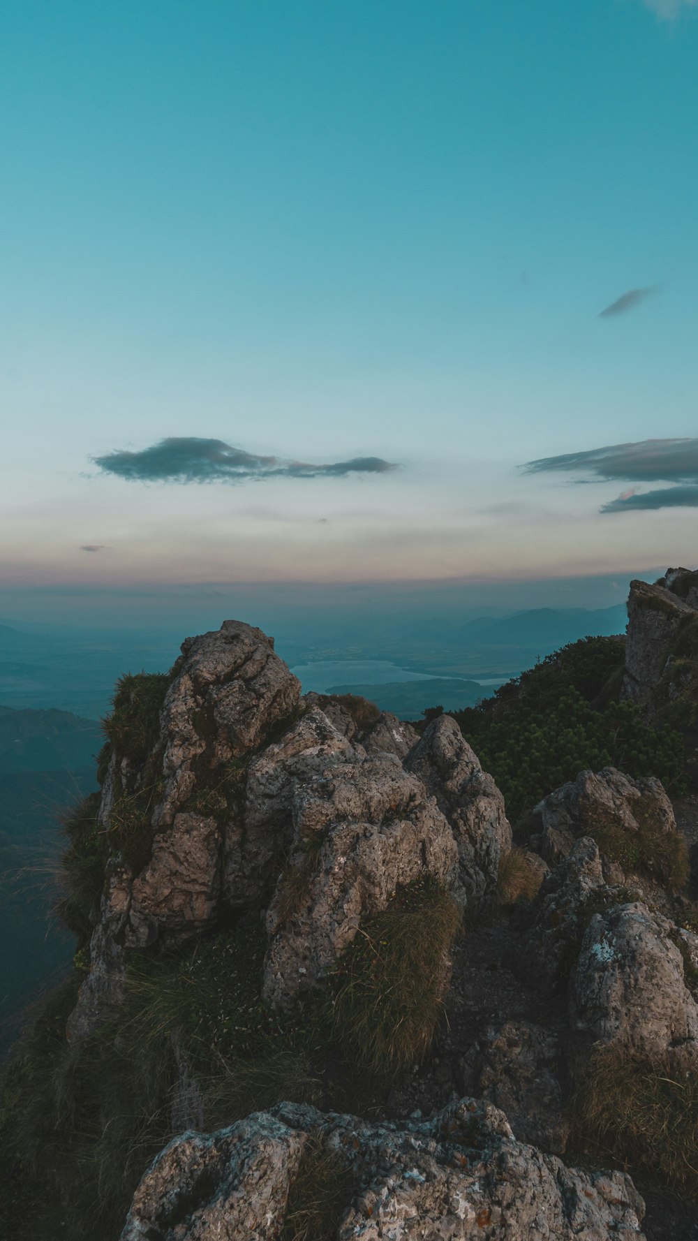 a person standing on top of a rocky mountain