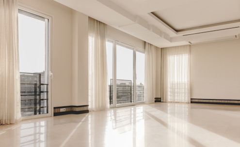 a large empty room with a lot of windows