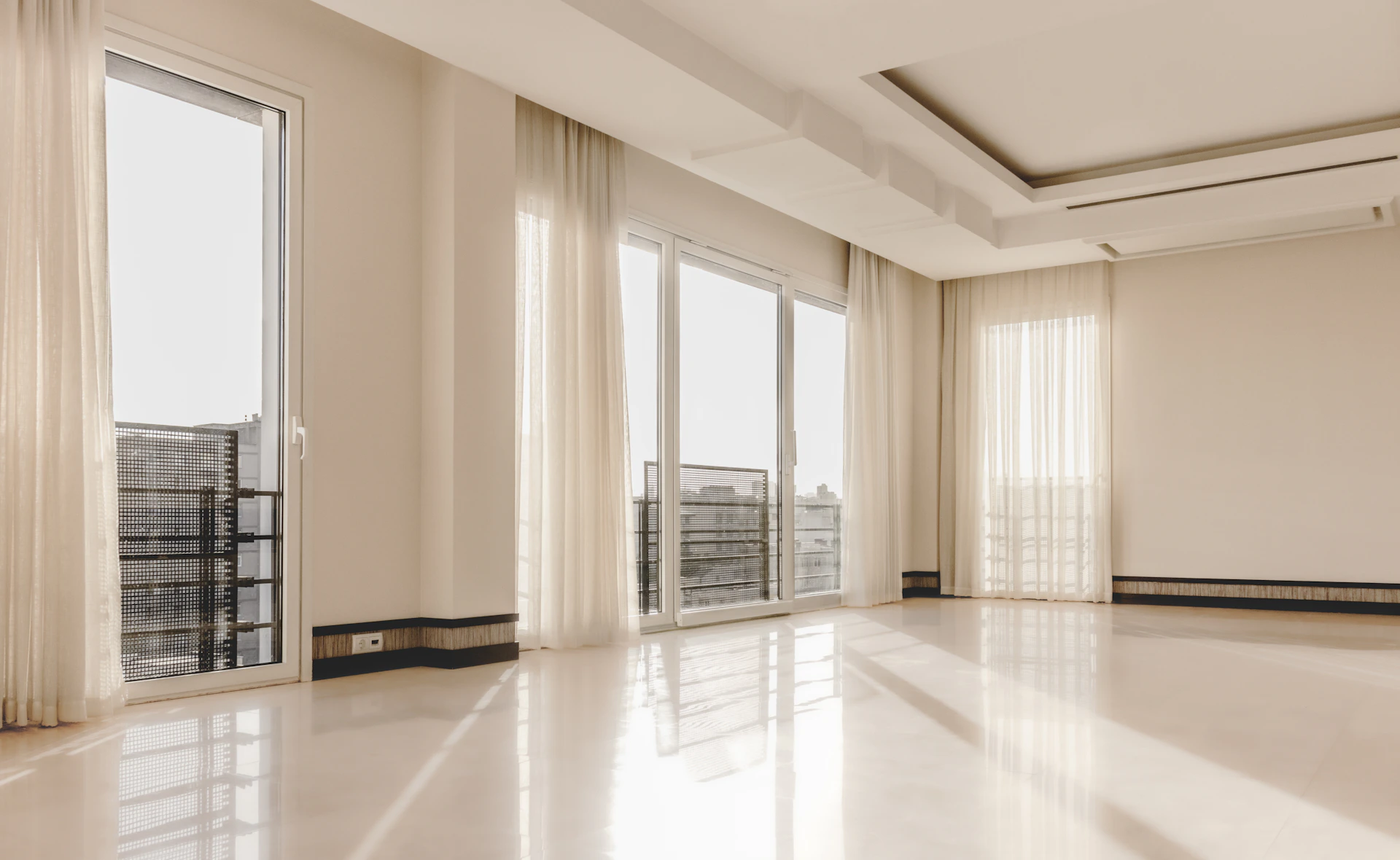 a large empty room with a lot of windows