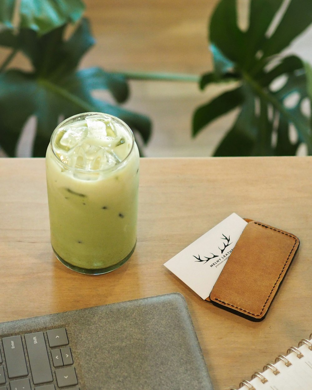 a drink sitting on top of a wooden table