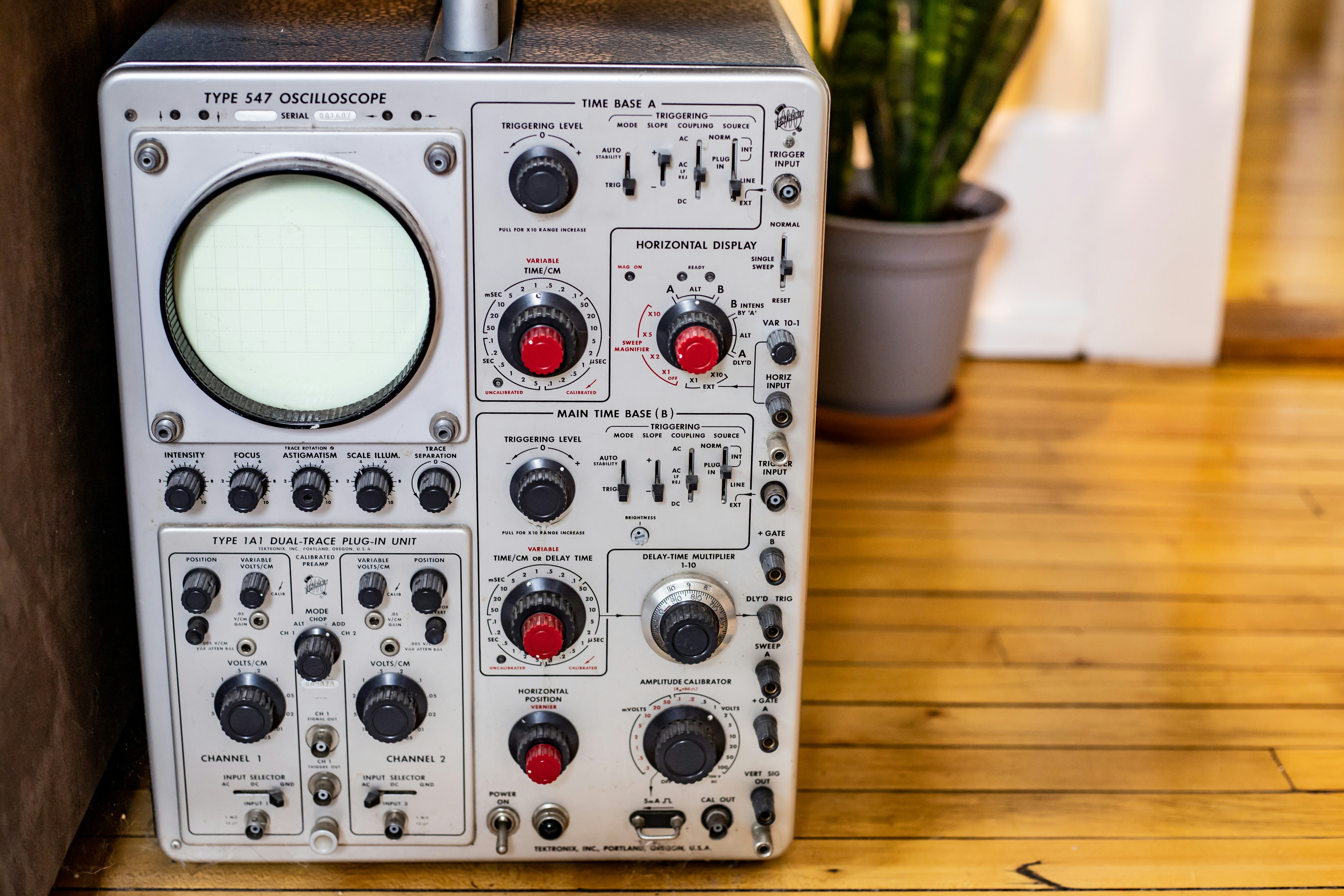 a close up of a sound board on a wooden floor