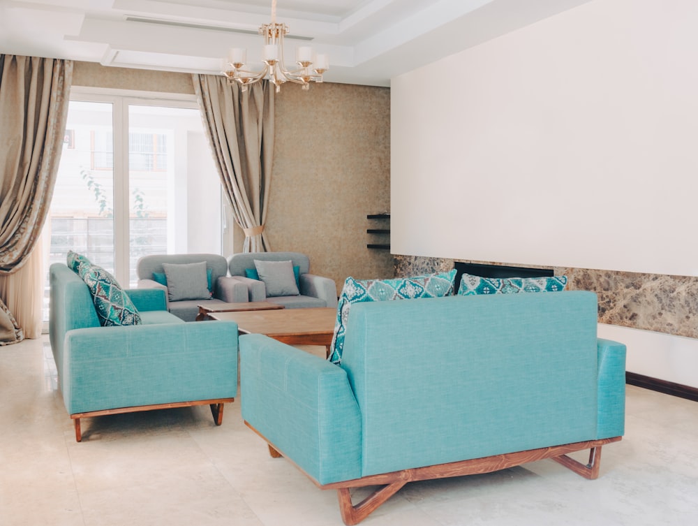 a living room filled with furniture and a chandelier