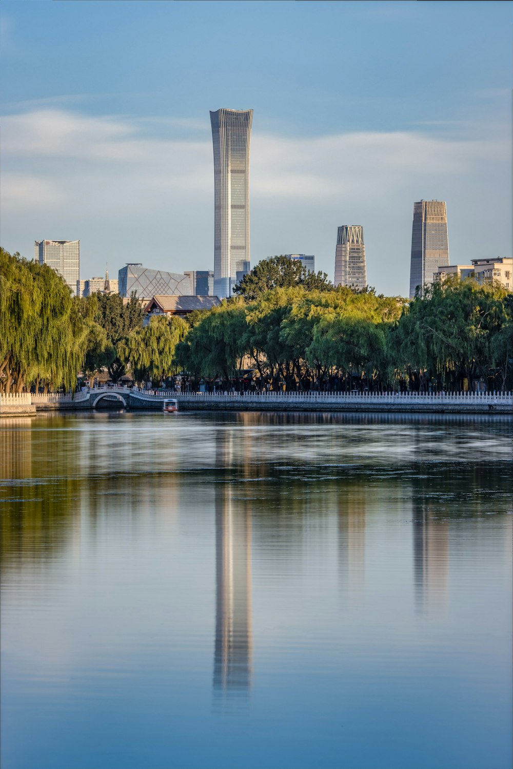 a large body of water with a city in the background