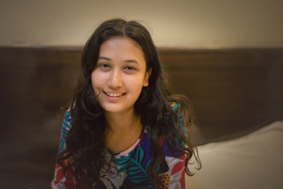 A warm, inviting portrait of Saroj Paudel working at a cozy home office.