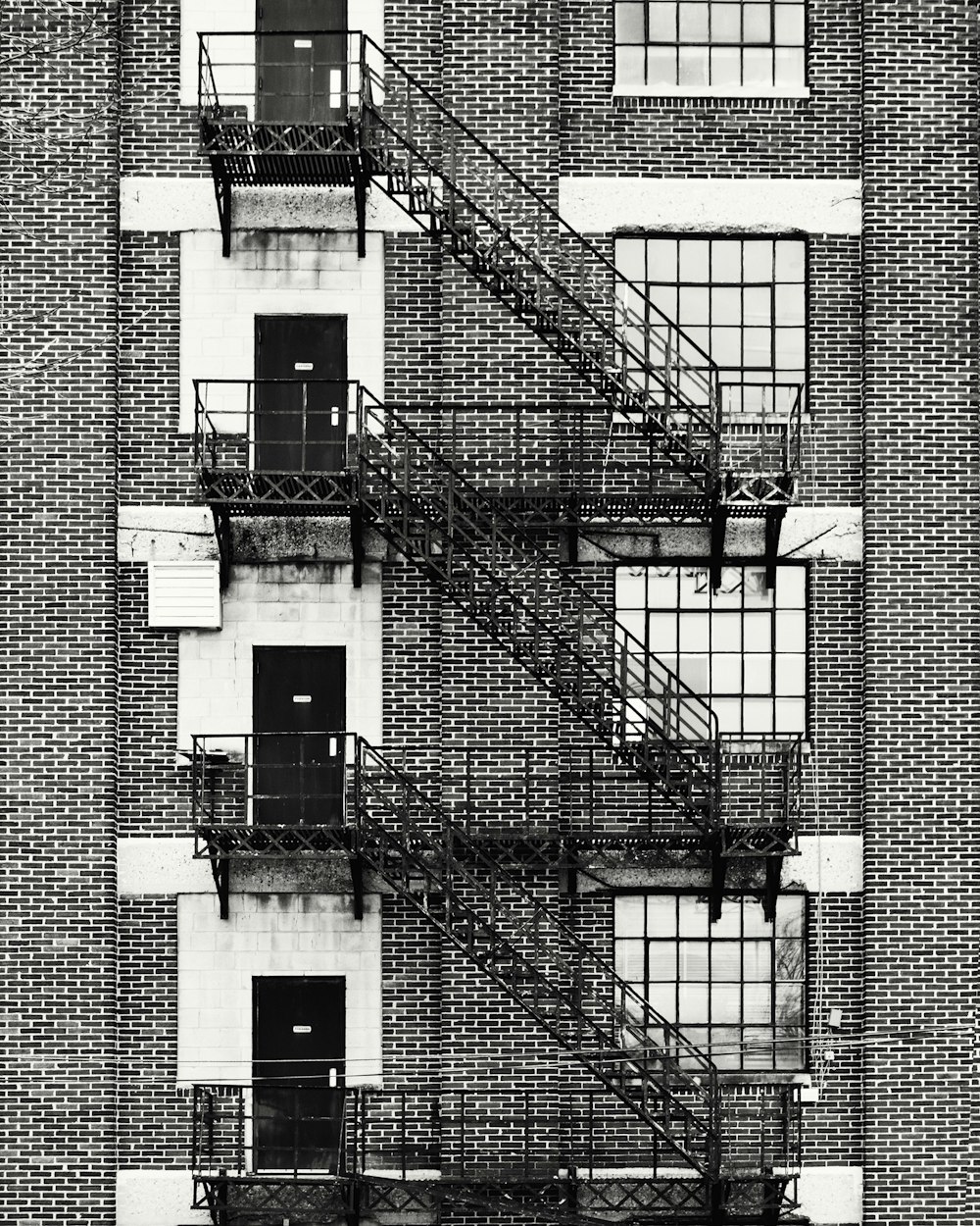 a black and white photo of a fire escape