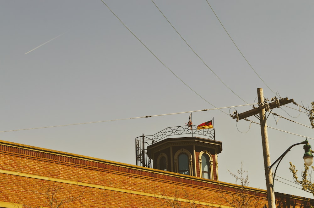 a tower with a flag on top of a building