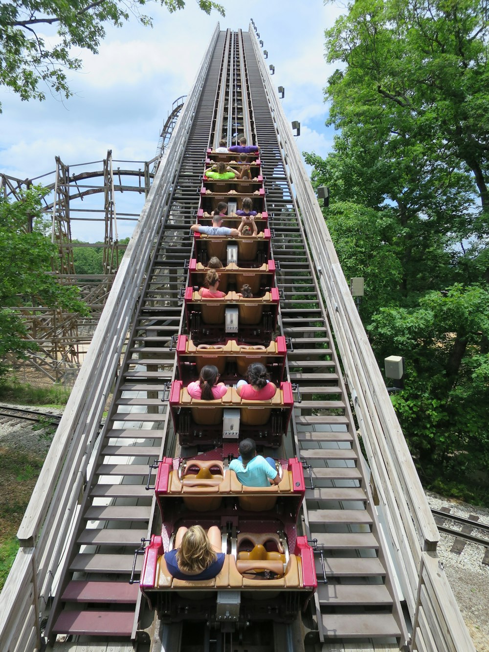 a roller coaster with people sitting on it