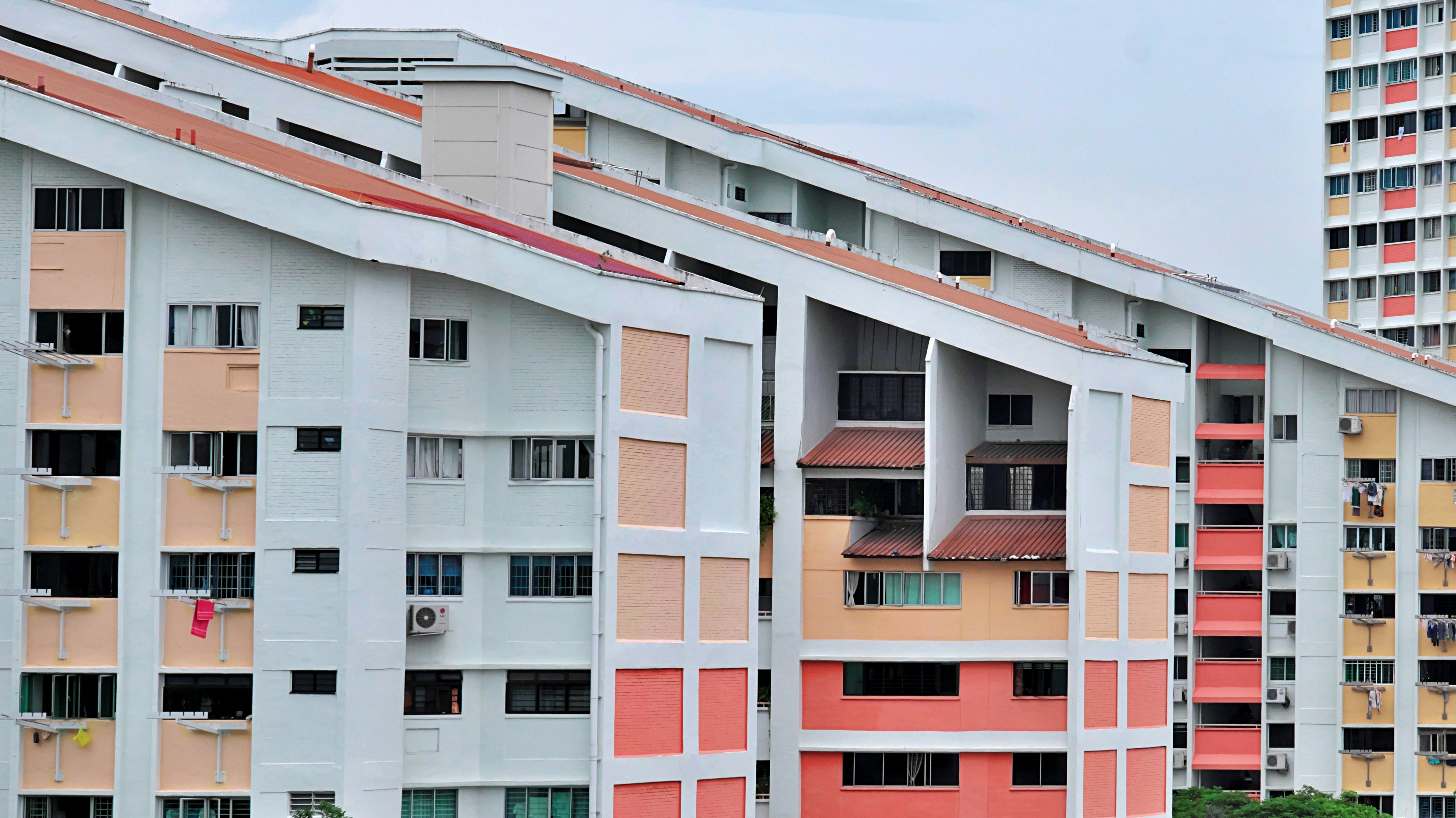 a tall building with many windows and balconies
