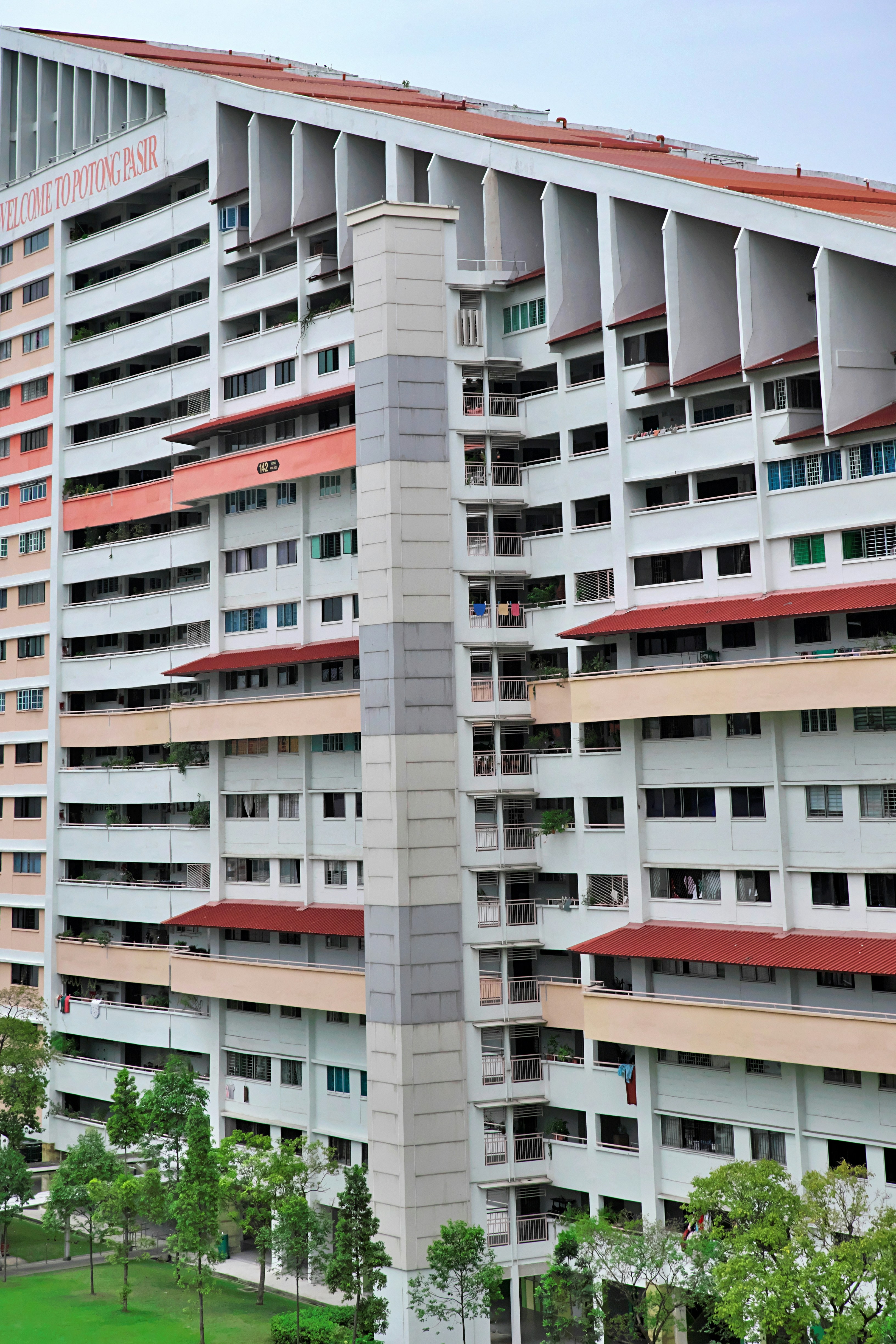 a tall building with many windows and balconies