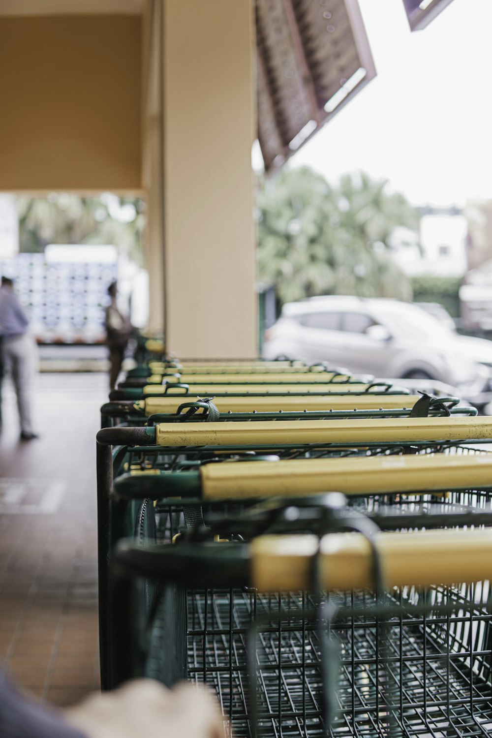 a row of shopping carts sitting in front of a building